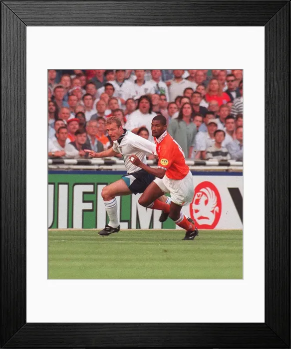 Framed Print : Englands Alan Shearer and Hollands Winston Bogarde battle for the ball during the England Framed Print : Englands Alan Shearer and Hollands Winston Bogarde battle for the ball during the England
