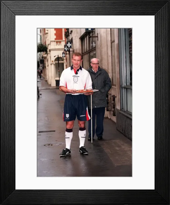 Framed Print : ALAN SHEARER MODELLING THE NEW 1997 ENGLAND HOME STRIP AND HOLDING A