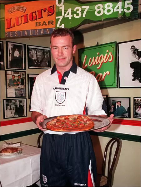 12 - ALAN SHEARER SHOWING OFF THE NEW 1997 ENGLAND KIT HOLDING A PIZZA