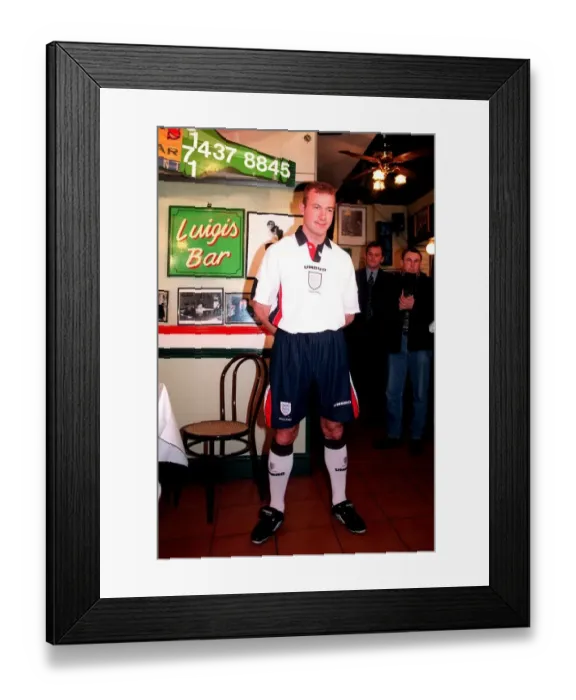 Framed Print : ALAN SHEARER MODELLING THE NEW 1997 ENGLAND FOOTBALL STRIP