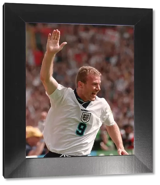 ALAN SHEARER WITH ARM RAISED CELEBRATING GOAL FOR ENGLAND AGAINST SCOTLAND DURING EURO 96