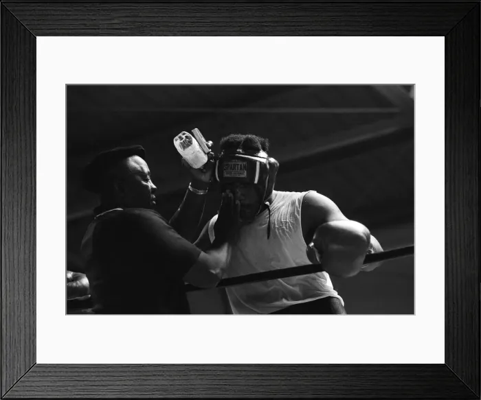Framed Print : World boxing champion George Foreman trains at the Farigrounds in Pleasanton