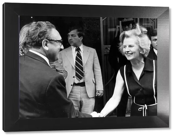 Margaret Thatcher shaking hands with Henry Kissinger outside Claridiges