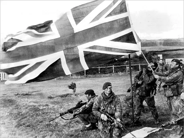 ROYAL MARINES RAISE UNION JACK OVER THE FALKLAND ISLANDS 1982