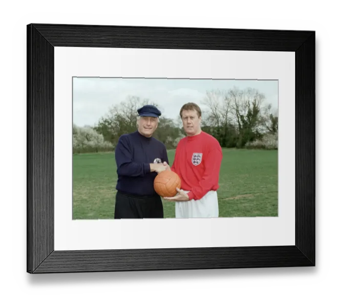 Framed Print : World Cup rivals Geoff Hurst and Hans Tilkowski reunite to play a game of football with
