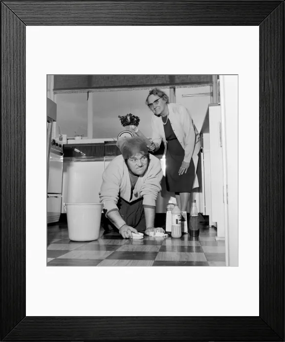 Framed Print : Les Dawson lends a hand at his mother-in-laws house in Unsworth, near Bury
