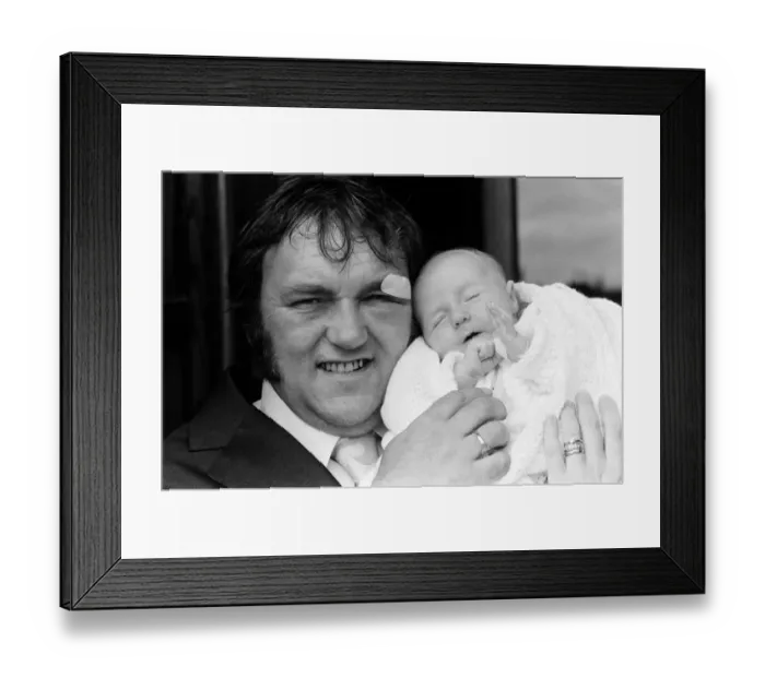 Framed Print : Les Dawson with his baby daughter Pamela Jane at her christening at Cleveleys, Lancashire Framed Print : Les Dawson with his baby daughter Pamela Jane at her christening at Cleveleys, Lancashire