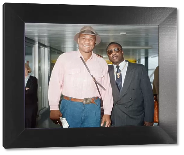 George Foreman and Joe Frazier at London Airport. 16th October 1989