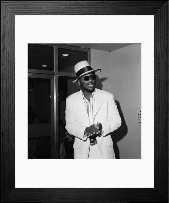 Framed Print : Joe Frazier at Heathrow airport, wearing dark glasses, still covering the injured eye Framed Print : Joe Frazier at Heathrow airport, wearing dark glasses, still covering the injured eye