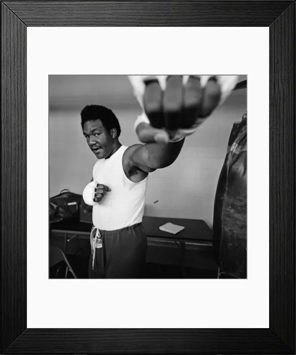 Framed Print : World heavyweight champion George Foreman during a training session at Hayward Boys Club