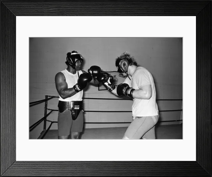 Framed Print : World heavyweight champion George Foreman during a training session at Hayward Boys Club Framed Print : World heavyweight champion George Foreman during a training session at Hayward Boys Club