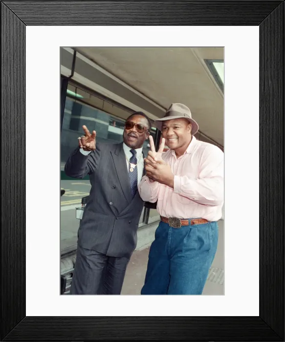 Framed Print : George Foreman and Joe Frazier at London Airport. 16th October 1989