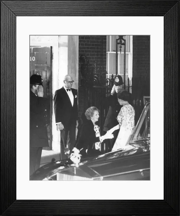 Framed Print : Margaret Thatcher curtsying to the Queen outside 10 Downing Street watched by Denis Framed Print : Margaret Thatcher curtsying to the Queen outside 10 Downing Street watched by Denis