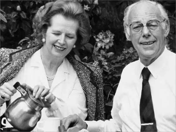 Margaret Thatcher and husband Denis drinking coffee in an outside cafe in a park - May