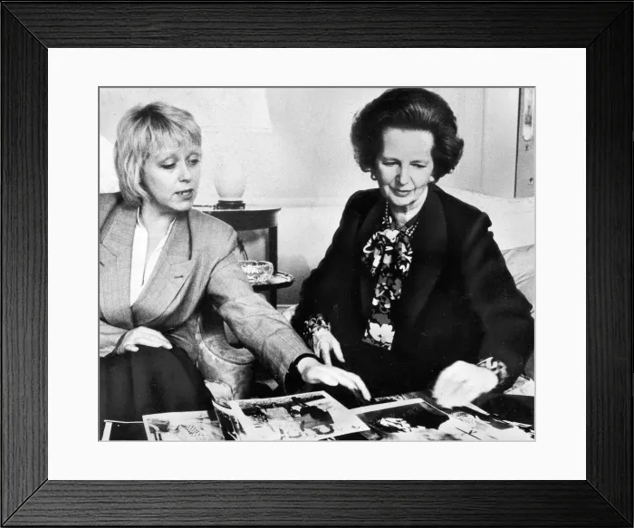 Framed Print : Margaret Thatcher looking over photographs with official - May 1987 Framed Print : Margaret Thatcher looking over photographs with official - May 1987