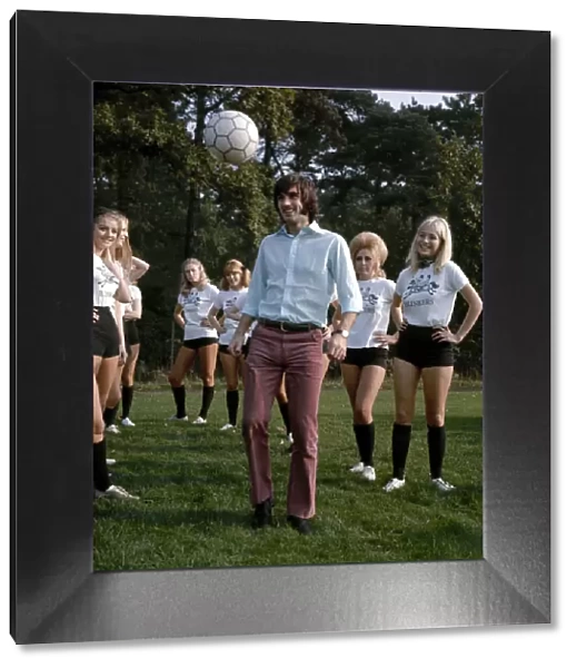 Manchester United footballer George Best shows girls of Blinkers United how to control a