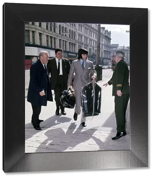 Manchester United and Northern Ireland footballer George Best arrives with a clean suit