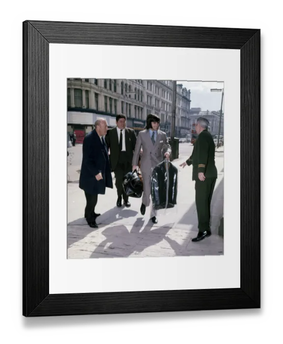 Framed Print : Manchester United and Northern Ireland footballer George Best arrives with a clean suit
