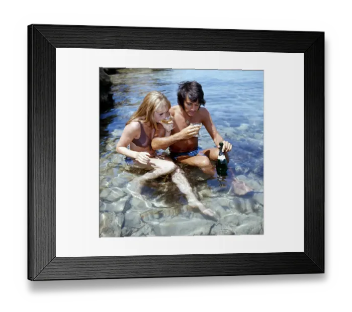 Framed Print : Manchester United footballer George Best on holiday with girlfriend Susan George while Framed Print : Manchester United footballer George Best on holiday with girlfriend Susan George while