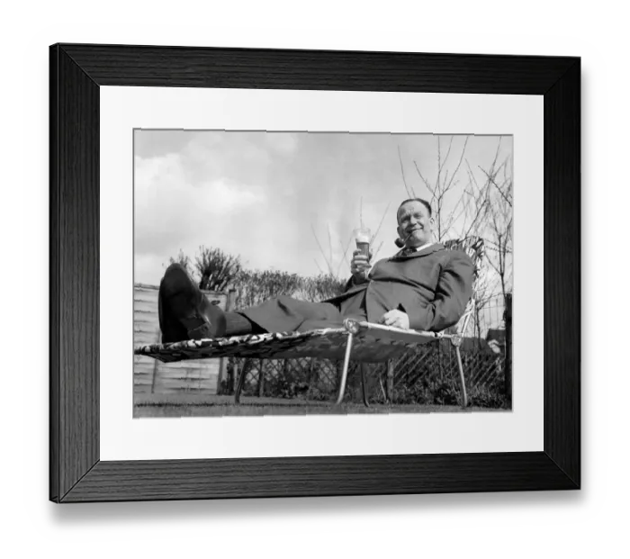 Framed Print : Sacked Manchester City manager George Poyser relaxes in the sunshine with a glass of beer Framed Print : Sacked Manchester City manager George Poyser relaxes in the sunshine with a glass of beer