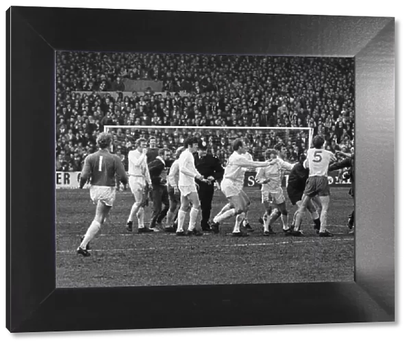 Leeds players surround referee Ray Tinkler after he awarded a controversial goal