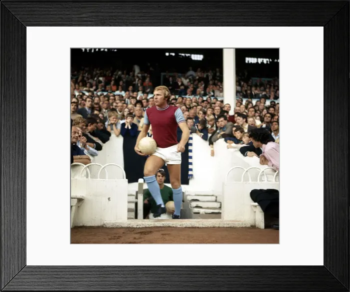 Framed Print : West Ham United captain leads out his team at Upton Park before the League Division One Framed Print : West Ham United captain leads out his team at Upton Park before the League Division One