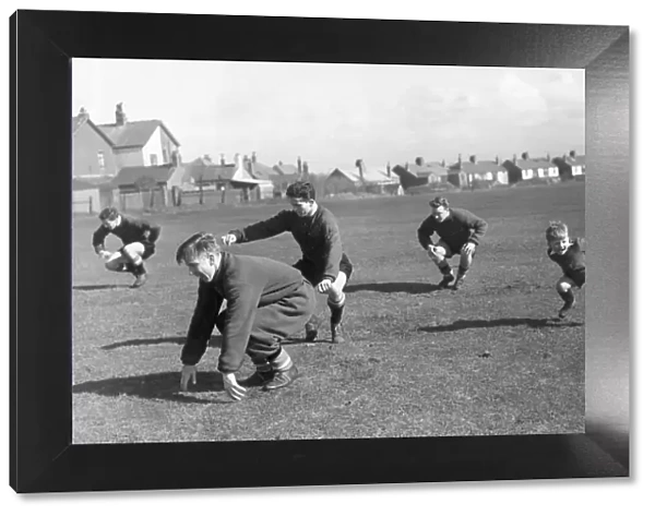 Manchester United. Four year old Charlie Woolett joining in the training session in