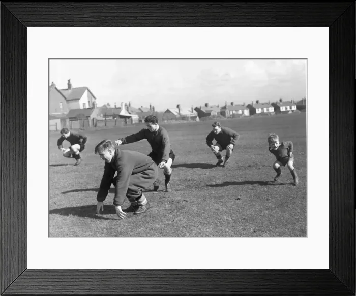 Framed Print : Manchester United. Four year old Charlie Woolett joining in the training session in