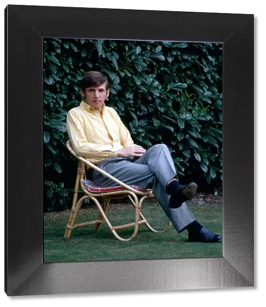 West Ham United footballer Martin Peters relaxes sitting on a deckchair October