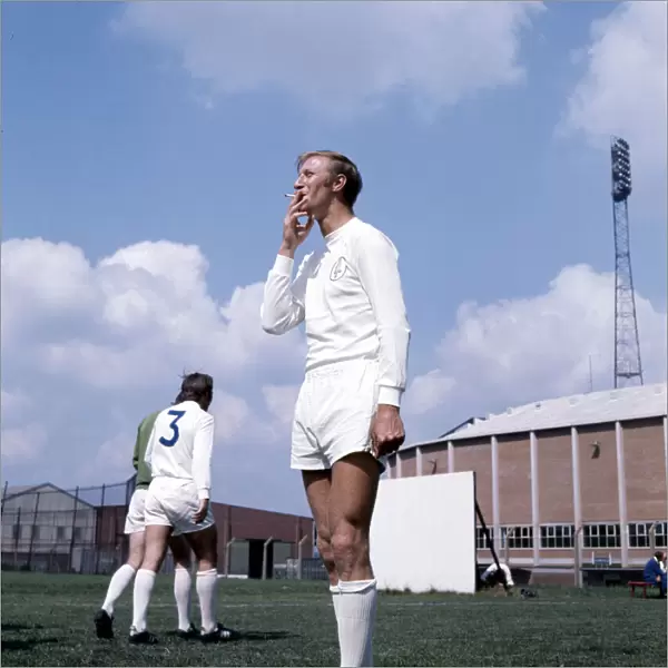 Leeds United footballer Jack Charlton smoking a cigarette during a training session