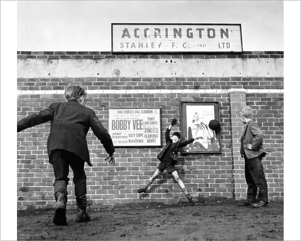 Accrington Stanley. No more football inside the ground so three youngsters play outside