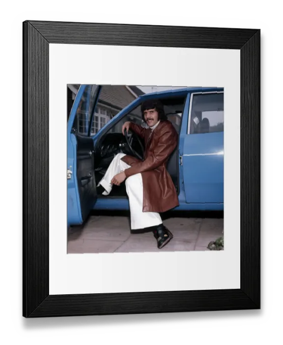 Framed Print : Liverpool footballer Peter Cormack in his car, wearing some of the clothes he has Framed Print : Liverpool footballer Peter Cormack in his car, wearing some of the clothes he has