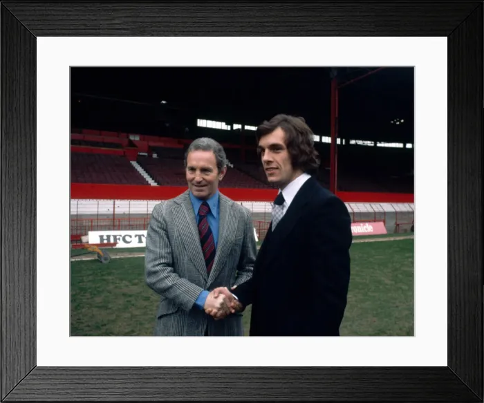 Framed Print : Scottish forward Joe Jordan shakes hands with manager Dave Sexton after signing for new Framed Print : Scottish forward Joe Jordan shakes hands with manager Dave Sexton after signing for new