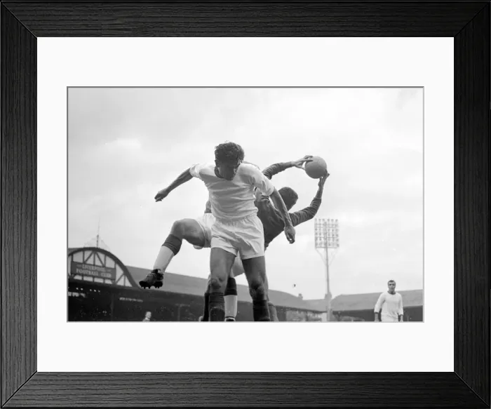 Framed Print : Liverpool players Roger Hunt and Sneddon jump up for the ball with Arsenal goalkeeper Jim Framed Print : Liverpool players Roger Hunt and Sneddon jump up for the ball with Arsenal goalkeeper Jim