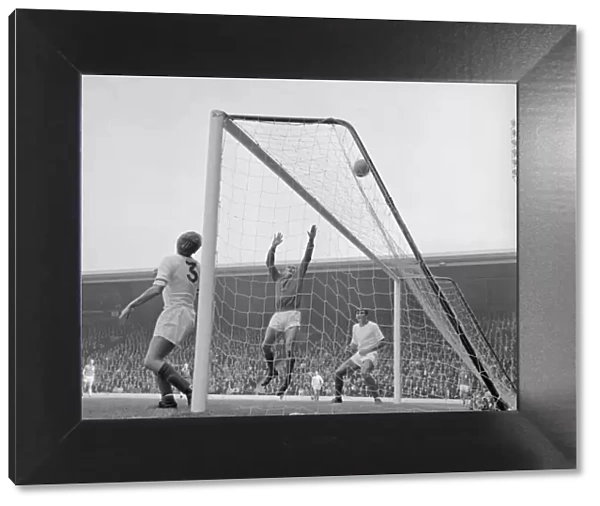 Arsenal defenders Billy McCullough and Don Howe assist goalkeeper Jim Furnell to put this