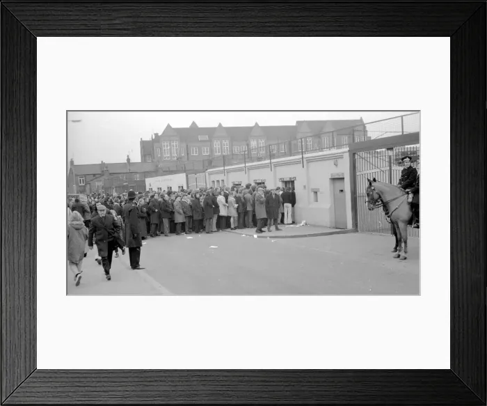 Framed Print : Fans queue up outisde The Den, home of Millwall football club Framed Print : Fans queue up outisde The Den, home of Millwall football club