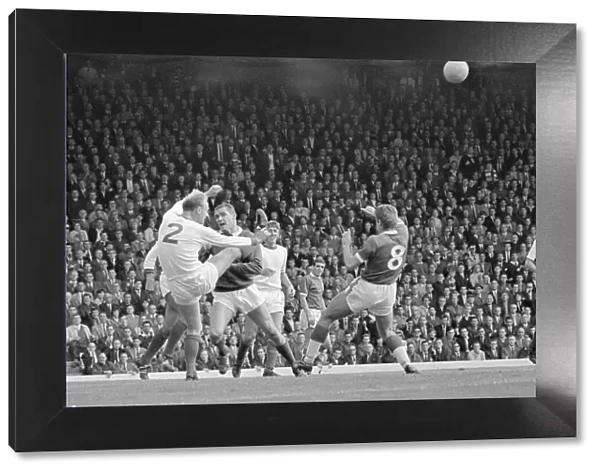 Arsenal defender Don Howe clears the ball from the goal line