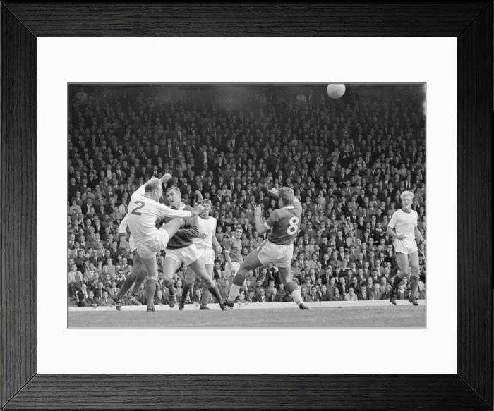 Framed Print : Arsenal defender Don Howe clears the ball from the goal line