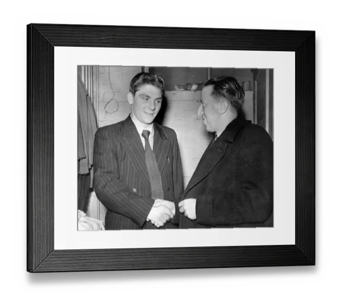 Framed Print : Manchester United league debutante 16 and a half years old Duncan Edwards receives