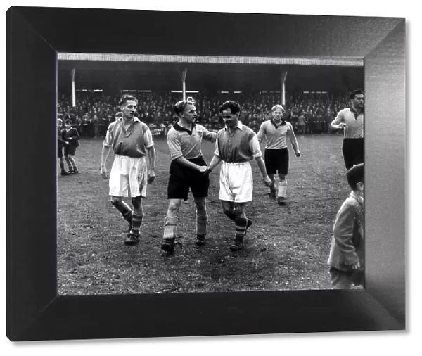 Hull captain Raich Carter shakes hands with Edwards of Accrington after winning the game