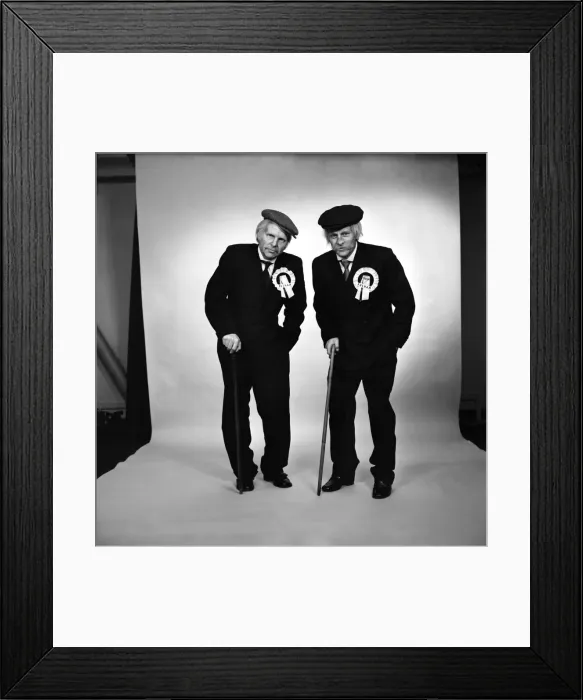 Framed Print : Fulham footballers Bobby Moore (left) and Alan Mullery dressed in suits and make-up Framed Print : Fulham footballers Bobby Moore (left) and Alan Mullery dressed in suits and make-up