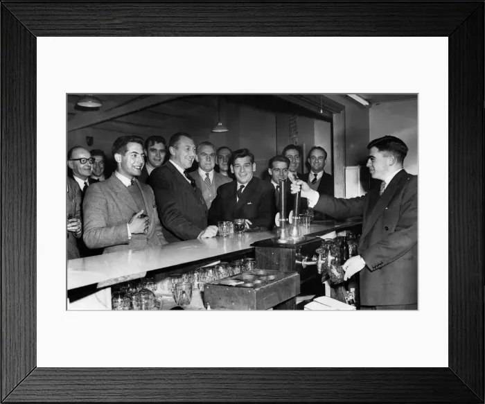 Framed Print : Members of Davenport Rugby league football club seen here enjoying a pint of beer after a