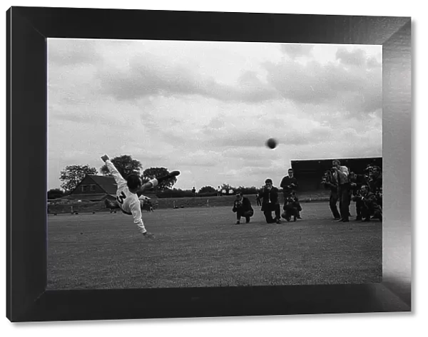 Jimmy Greaves of Spurs puts on show for the press doing a scissor kick at the spurs photo