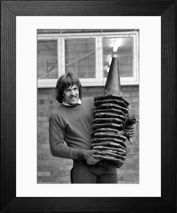 Framed Print : Sport: Football: West Ham Training. Goalkeeper Phil Parkes carrying a pile of cones Framed Print : Sport: Football: West Ham Training. Goalkeeper Phil Parkes carrying a pile of cones