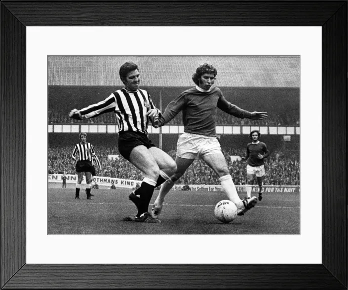Framed Print : Ollie Burton of Newcastle United tries to tackle Alan Ball of Everton during their match Framed Print : Ollie Burton of Newcastle United tries to tackle Alan Ball of Everton during their match