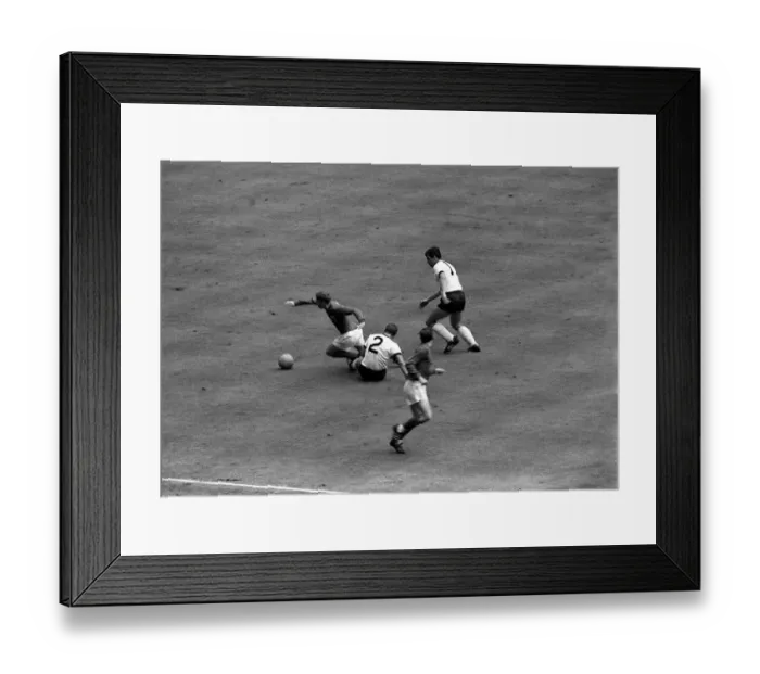 Framed Print : Alan Ball of England goes past West German defenders during the 1966 World Cup Framed Print : Alan Ball of England goes past West German defenders during the 1966 World Cup