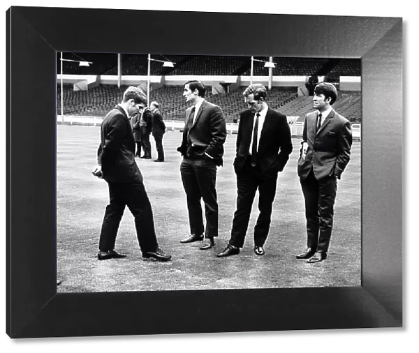 Everton midfielders Alan Ball and Howard Kendall inspect the Wembley pitch with teammates