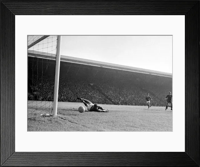 Framed Print : Manchester United goalkeeper Alex Stepney tips a shot from Liverpool forward ian Saint Framed Print : Manchester United goalkeeper Alex Stepney tips a shot from Liverpool forward ian Saint