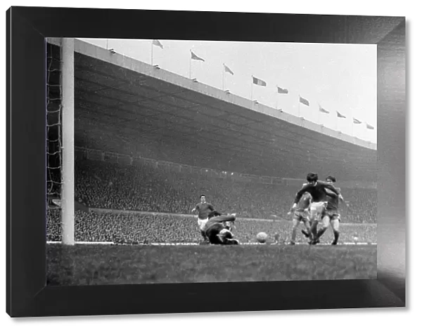 Manchester United forward George Best has his shot saved at point blank range by Chelsea