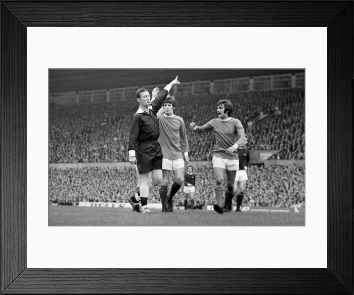 Framed Print : Manchester Uniteds George Best argues with referee during the league match against Framed Print : Manchester Uniteds George Best argues with referee during the league match against